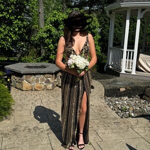 Like new Sherri Hill Black and Gold Gown